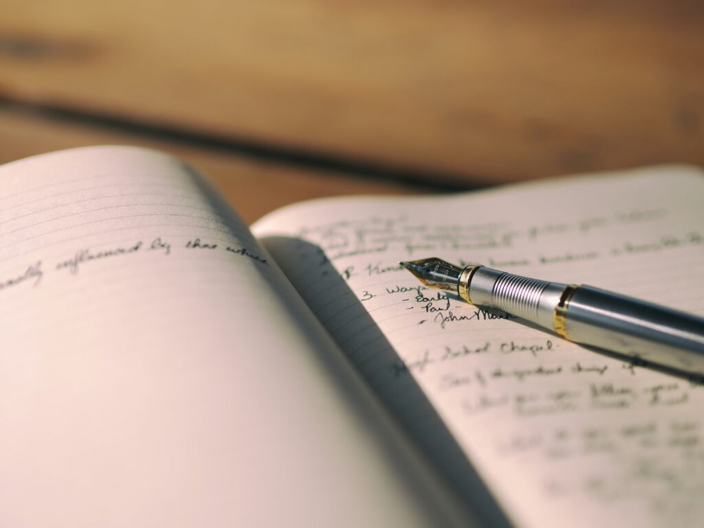 Fountain pen on notebook.