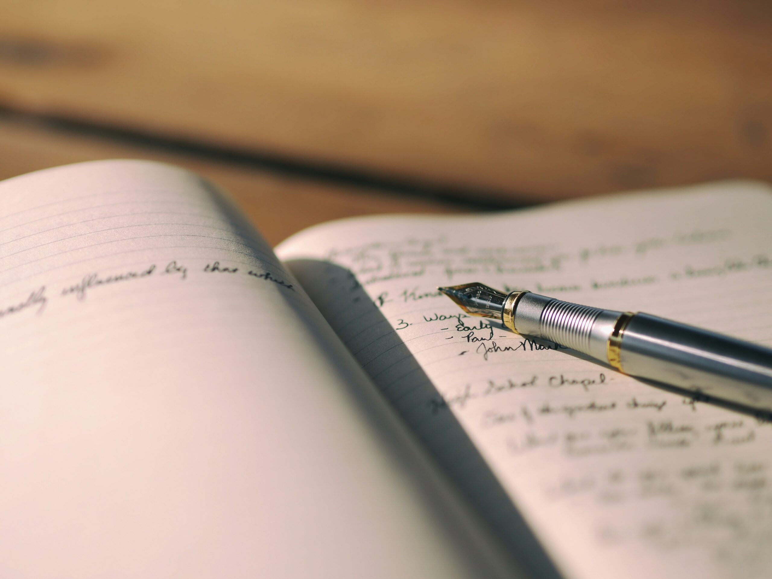 Fountain pen on notebook.